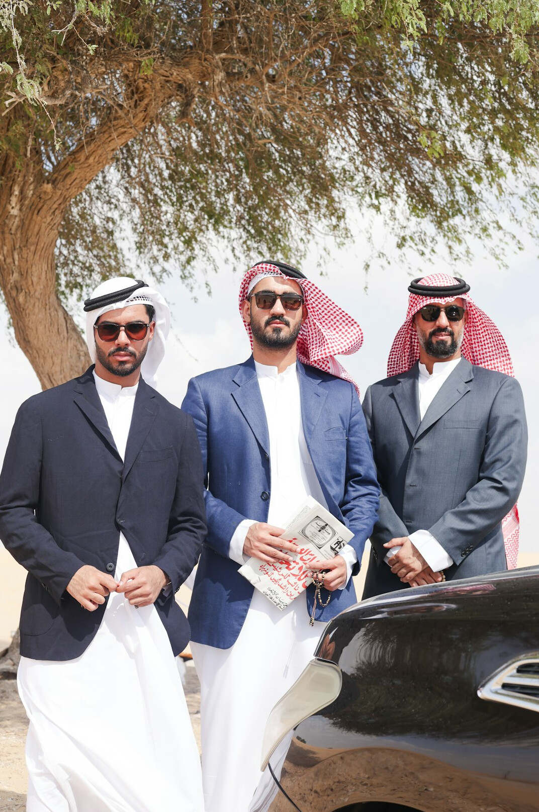 Group of four business executives standing together
